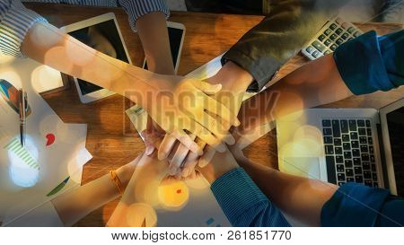 People In Team Harmonious Hand Meeting With Worm Light
