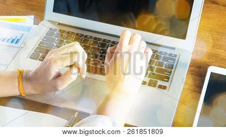 Employee Working With Computer Or Notebook With Boke Light