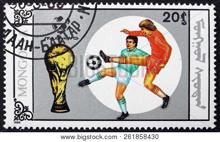 Mongolia - Circa 1990: A Stamp Printed In Mongolia Shows Soccer Players In Action, 1990 World Cup So