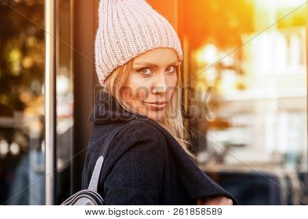 Portrait Female Student On Bright Background. Beautiful Modern Urban Young Woman Wearing Pink Knitti