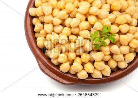 Casserole Of Chick-peas Cooked With Parsley On A White Background