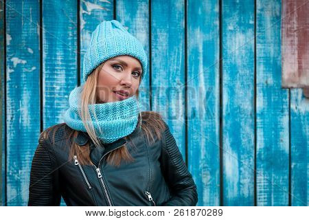 Portrait Female Student On Bright Background. Beautiful Modern Urban Young Woman Wearing Blue Knitti