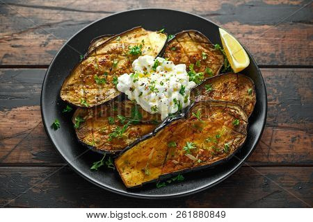 Healthy Vegeterain Oven Baked Aubergines, Eggplant With Cottage Cheese Dip, Parsley And Lemon Wedge.