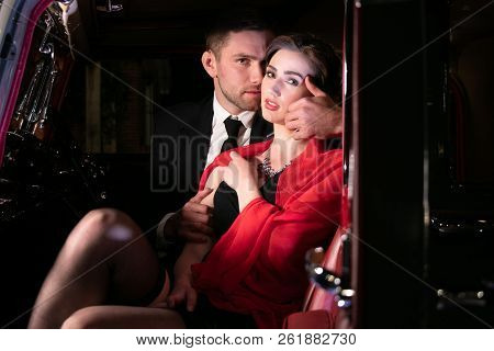 Good Looking Sexy Couple, Handsome Man In Suit, Beatiful Woman In Red Dress, Embrace Passionately In