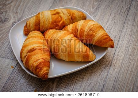A Rich Variety Of Food Photography Croissant.
Delicious Croissants On A Square White Plate On A Wood