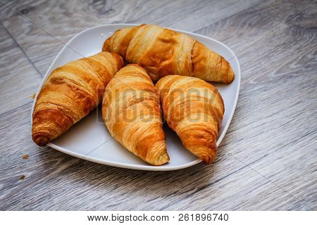 A Rich Variety Of Food Photography Croissant.
Delicious Croissants On A Square White Plate On A Wood