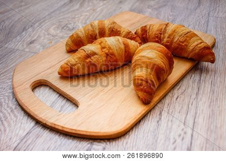A Rich Variety Of Food Photography Croissant.
Delicious Croissants On A Square White Plate On A Wood