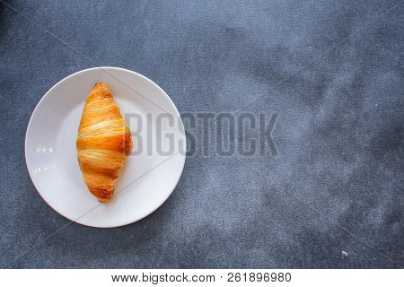 A Rich Variety Of Food Photography Croissant.
Four Croissants On A Wooden Light Cutting Board On Dar