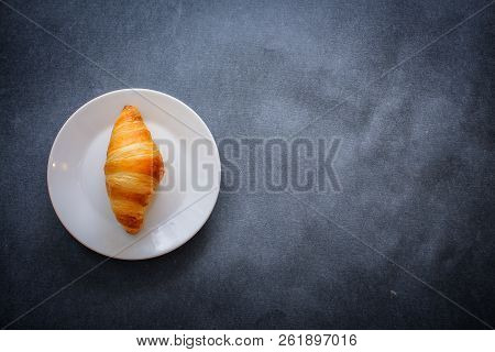 A Rich Variety Of Food Photography Croissant.
One Delicious Croissant On A Dessert White Plate On Da