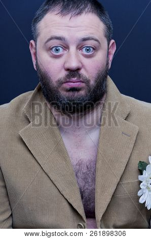 Portrait Of Shocked Man With Velvet Jacket On A Naked Body
