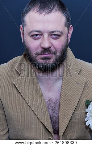 Portrait Of Suspicious Man With Velvet Jacket On A Naked Body