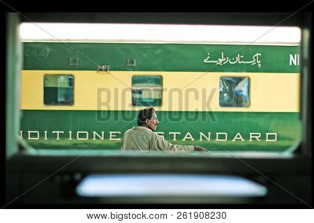 Passenger Sitting On A Bench And Waiting For Train At Karachi Cantt Station - 17-03-2013