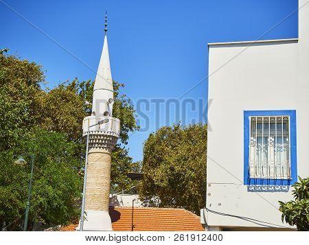 Minaret Of Turkkuyusu Cami Mosque, View From Turgut Reis Street. Bodrum. Mugla Province, Turkey.