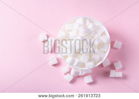 Sugar Cubes In White Plate On Pink Background, Flat Lay
