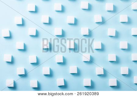 Sugar Cubes Regular Pattern On Blue Background, Flat Lay Scene