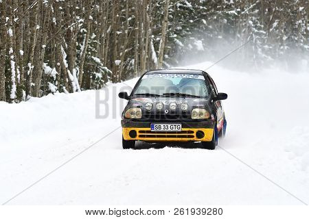 Covasna, Romania - January 14-15, 2017: Unknown Pilots Competing In Winter Rally Covasna 2017 On Jan