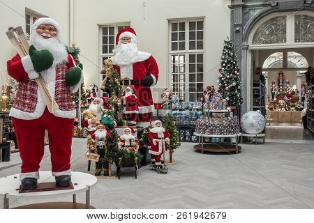 Antwerp, Belgium - September 24, 2018: Two Tall Santa Claus Mannequins Surrounded By More Smaller On