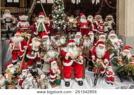 Antwerp, Belgium - September 24, 2018: Santa Claus Mannequin Group Display Surrounded Christmas Gift