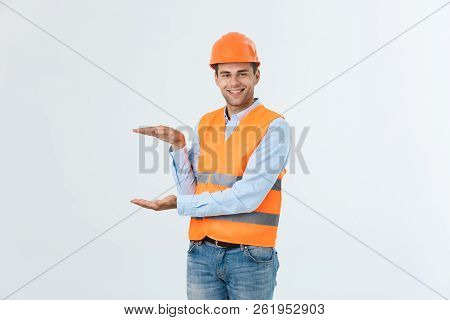 Happy Beard Engineer Holding Hand On Side And Explaining Something, Guy Wearing Caro Shirt And Jeans