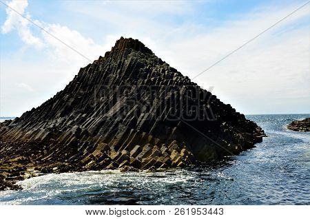 A View Of The Prehistoric Volcanic Geological Rock Formations On The Scottish Island Of Staffa
