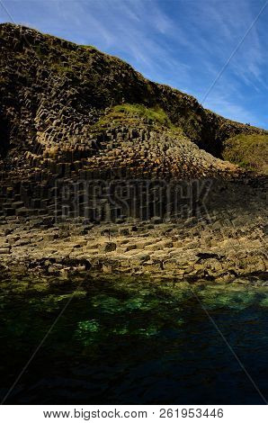 A View Of The Prehistoric Volcanic Geological Rock Formations On The Scottish Island Of Staffa