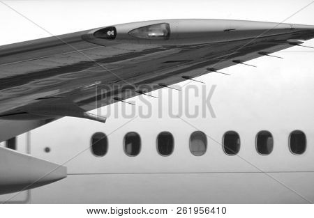Airplane Side View With A Wing And Windows
