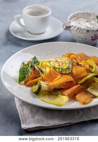 Braised Zucchini And Carrots With Sesame On Plate