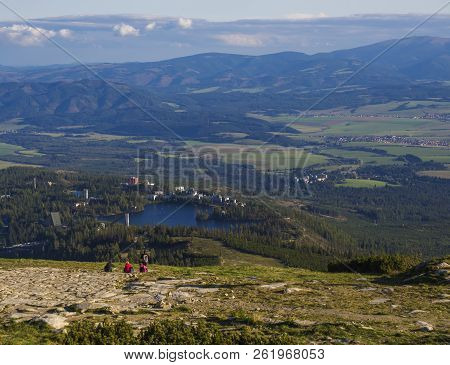 Aerial View On Strbske Pleso Village And Blue Mountain Lake From Chata Pod Soliskom With Forest, Hil