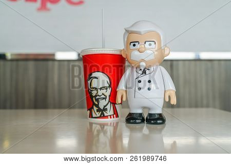 Bangkok ,thailand- September 15,2018: Colonel Harland Sanders Statue Doll With Kfc Cold Drink