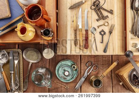 An Overhead Photo Of Many Vintage Objects, Flea Market Stuff On A Wooden Background