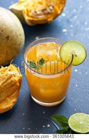Exotic Fruit Juice From Bel Fruit Or Wooden Apple Called In India Bel Ka Sharbat. Cold Fruit Drink W