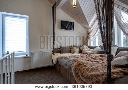 Interior Of A Modern House Spacious Hallway With Big Soft Resting Place. Contemporary Wide Sofa With