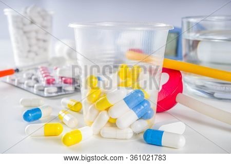 Pharmaceutical Medicine Pills Concept, Assorted Various Pills, Tablets And Capsules With Medical Syr