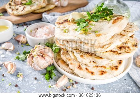 Indian Naan Flat Bread. Indian Indian Traditional Tortillas Pita Bread, With Herbs, Olive Oil And Ga