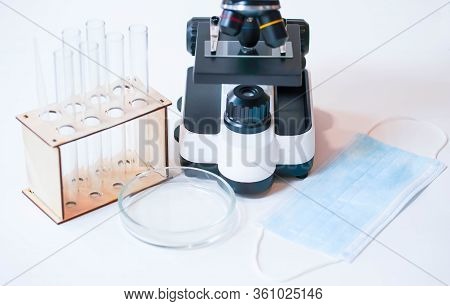 Medical Microscope, Test Tubes And Cup On A White Background