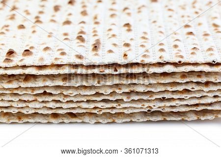 Matzah. Jewish Traditional Passover Bread. Pesach Celebration Symbol. Isolated On White. With Some F