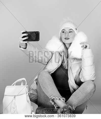 Girl In Puffed Coat Make Selfie. Faux Fur Fashion. Warm Winter Clothing. Phone Selfie. Flu And Cold 