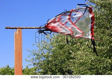 Wind-powered Bird Scarer In The Garden. Bird Scare Device Which Helps To Get Rid Of Nuisance Birds.