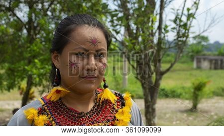 Lago Agrio, Sucumbios / Ecuador - February 20 2020: Woman Of The Cofan Ethnic Group Applying Makeup 