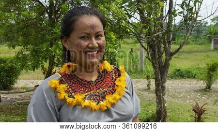 Lago Agrio, Sucumbios / Ecuador - February 20 2020: Woman Of The Cofan Ethnic Group Applying Makeup 