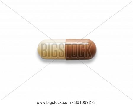 Pink Capsule Pill On White Isolated Background With Clipping Path And Copy Space. Omeprazole Drug Us