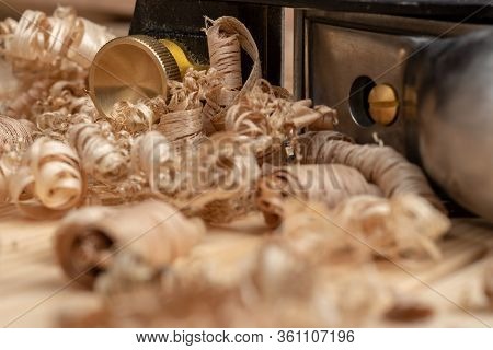 Small Block Plane With Wood Shavings On The Workbench
