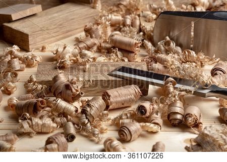 Chisel And Small Block Plane With Wood Shavings