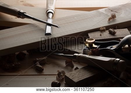 Chisel And Small Block Plane With Wood Shavings