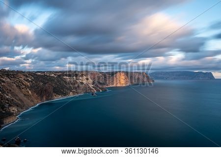 Seascape Over The Jasper Beach During Sunset. Long Exposure. Motion Blurry Clouds. Cape Fiolent, Bal