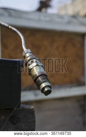 Diesel Fuel Injector With A Drop Of Fuel. Single Fuel Injector On A Metal Tube. Checking Fuel Inject