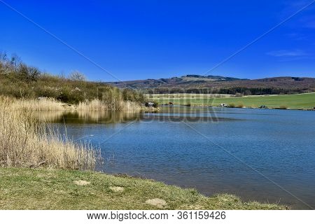 Spring Sun Walk Around A Large Lake In The Czech Republic.