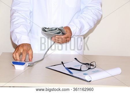 Close-up - Doctor Measures Blood Pressure