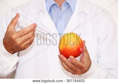Concept Health - A Scientist Makes Genetically Modified Vegetables And Fruits.