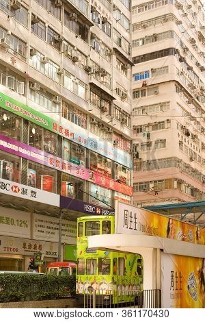 Causeway Bay, Hong Kong Island, Hong Kong, China - December 05, 2008: Traditional Tram And Store Sig